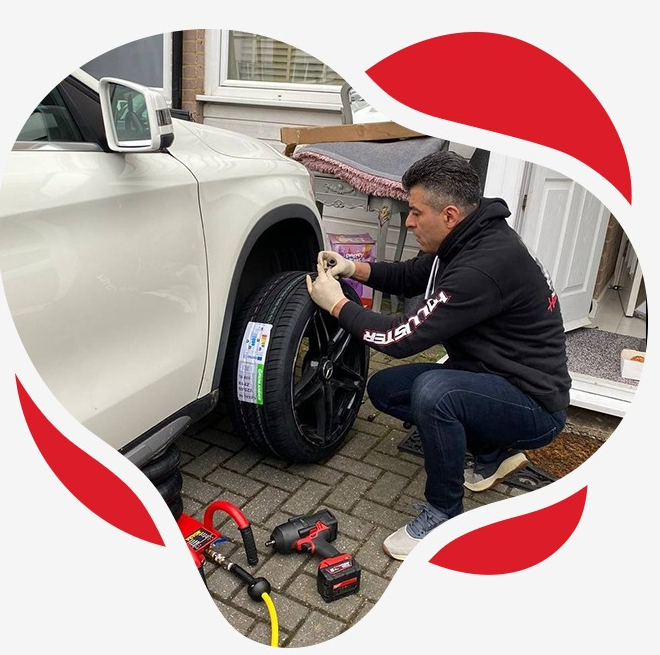 Fitter checking a tyre size on the sidewall